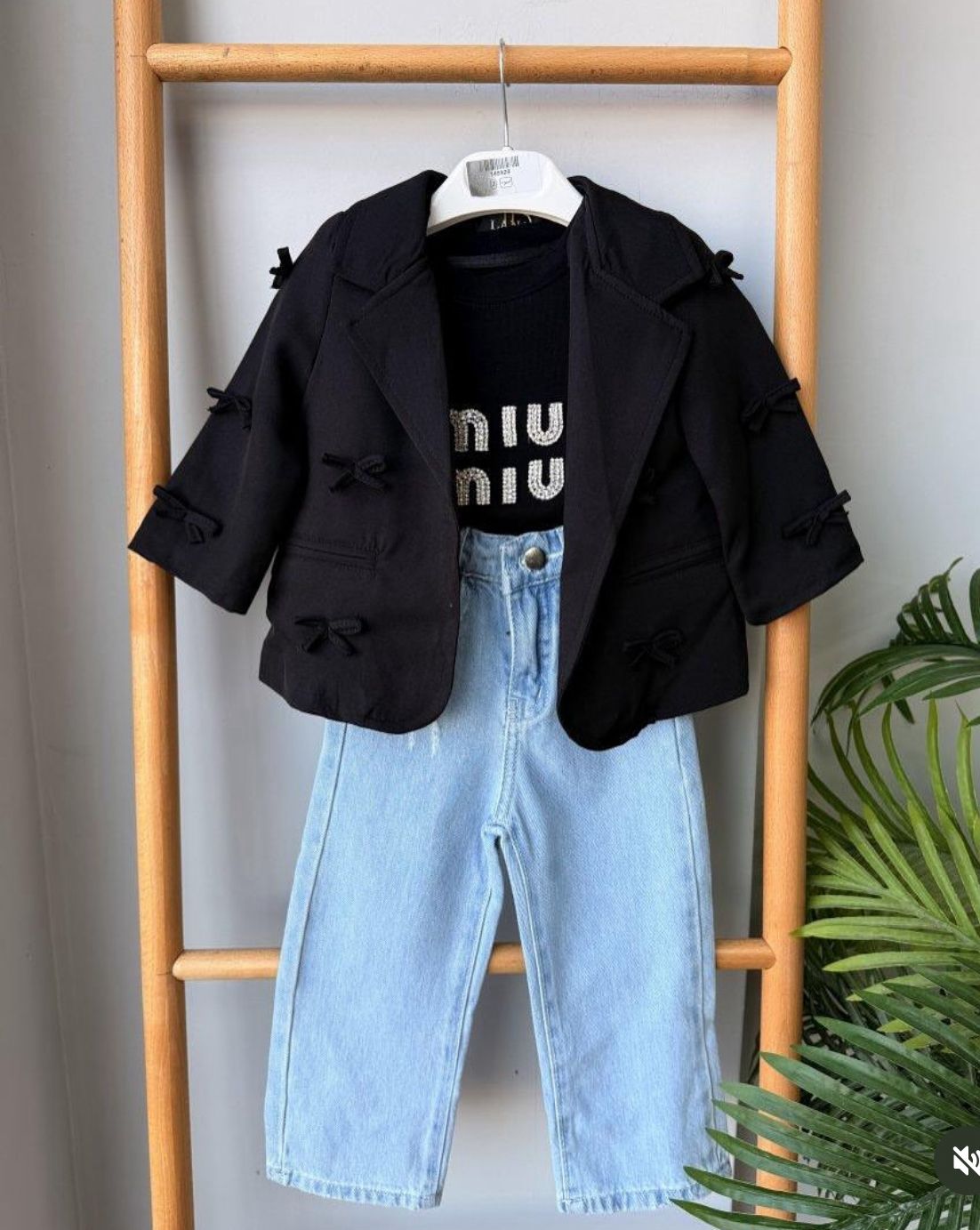 Fabric blazer with a miu T-shirt and jeans