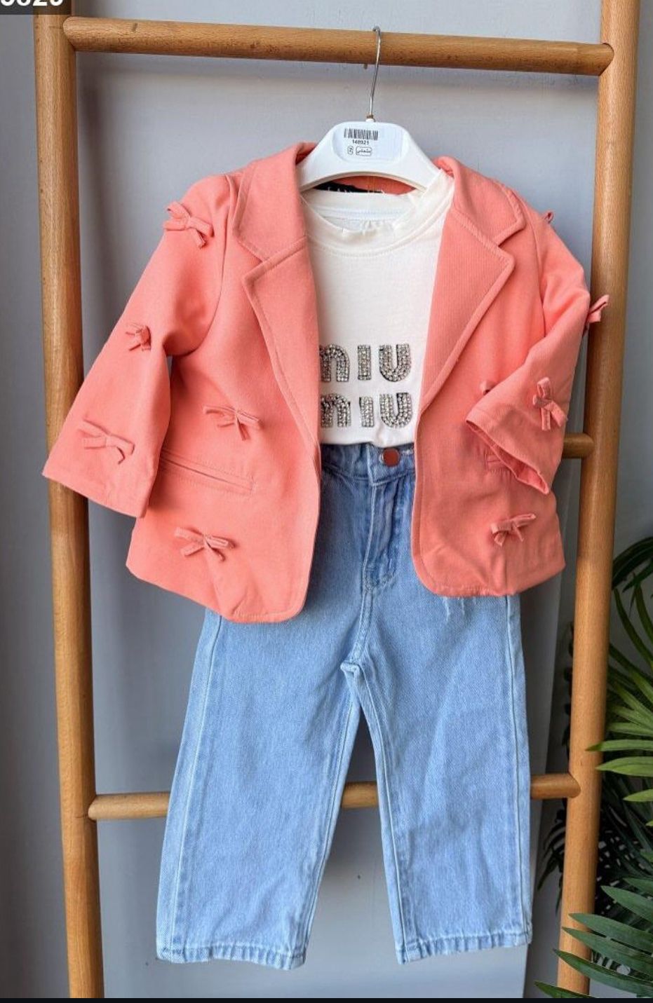 Fabric blazer with a miu T-shirt and jeans